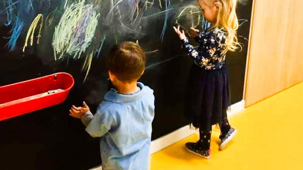 children writing on the blackboard